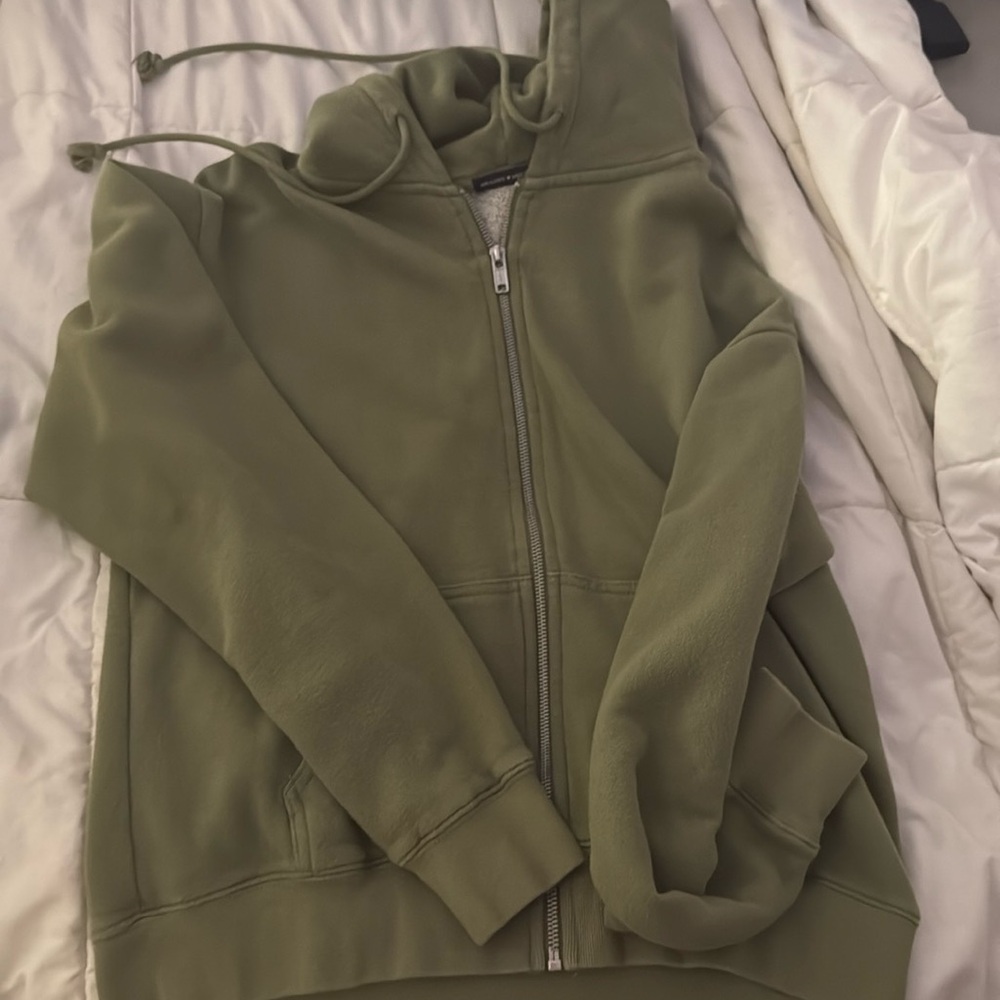 This is a brandy melville green zip up. Very soft and lightweight